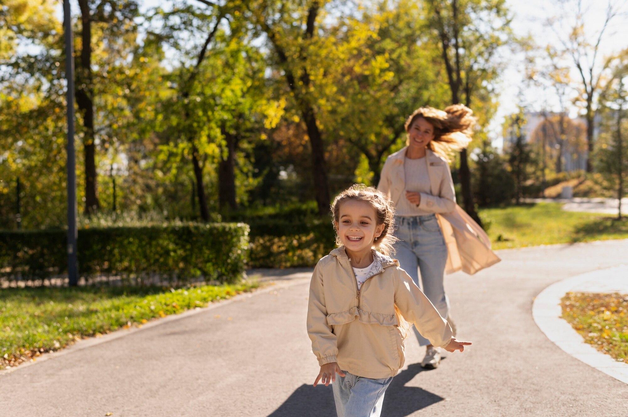 Natural park walking trail with trees and greenery